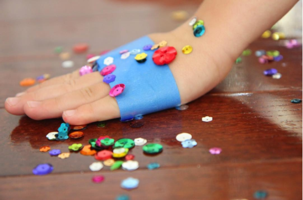 Tape is great for picking up sparkles, glitter, and other teeny-tiny things your kid spills.