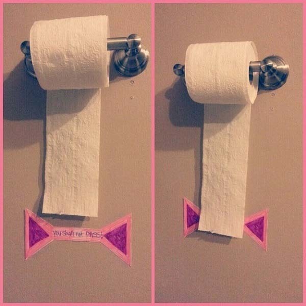 Keep your kid from wasting toilet paper by putting a "You shall not pass!" line on the wall.