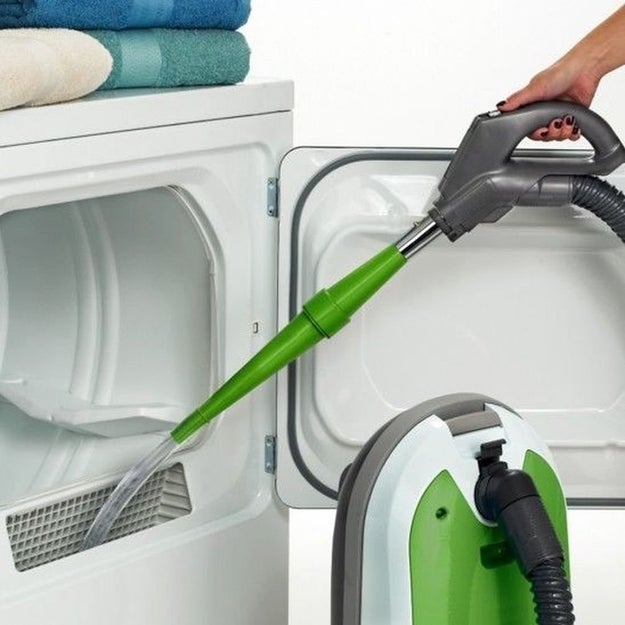 Get an attachment for your vacuum that'll help clean your dryer's lint trap or try a brush to scrub out all the lint.