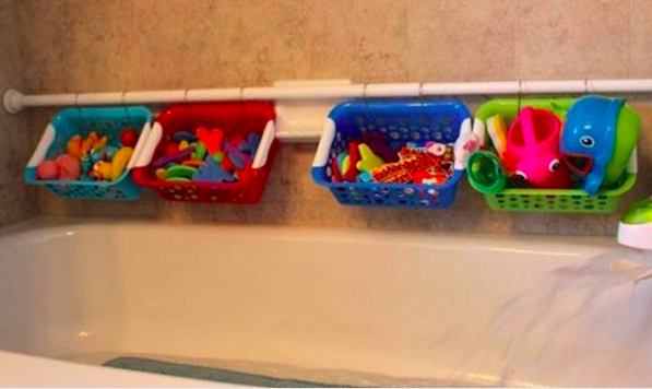 Use a shower rod and small plastic baskets to make the perfect way to store your kid's bath toys.