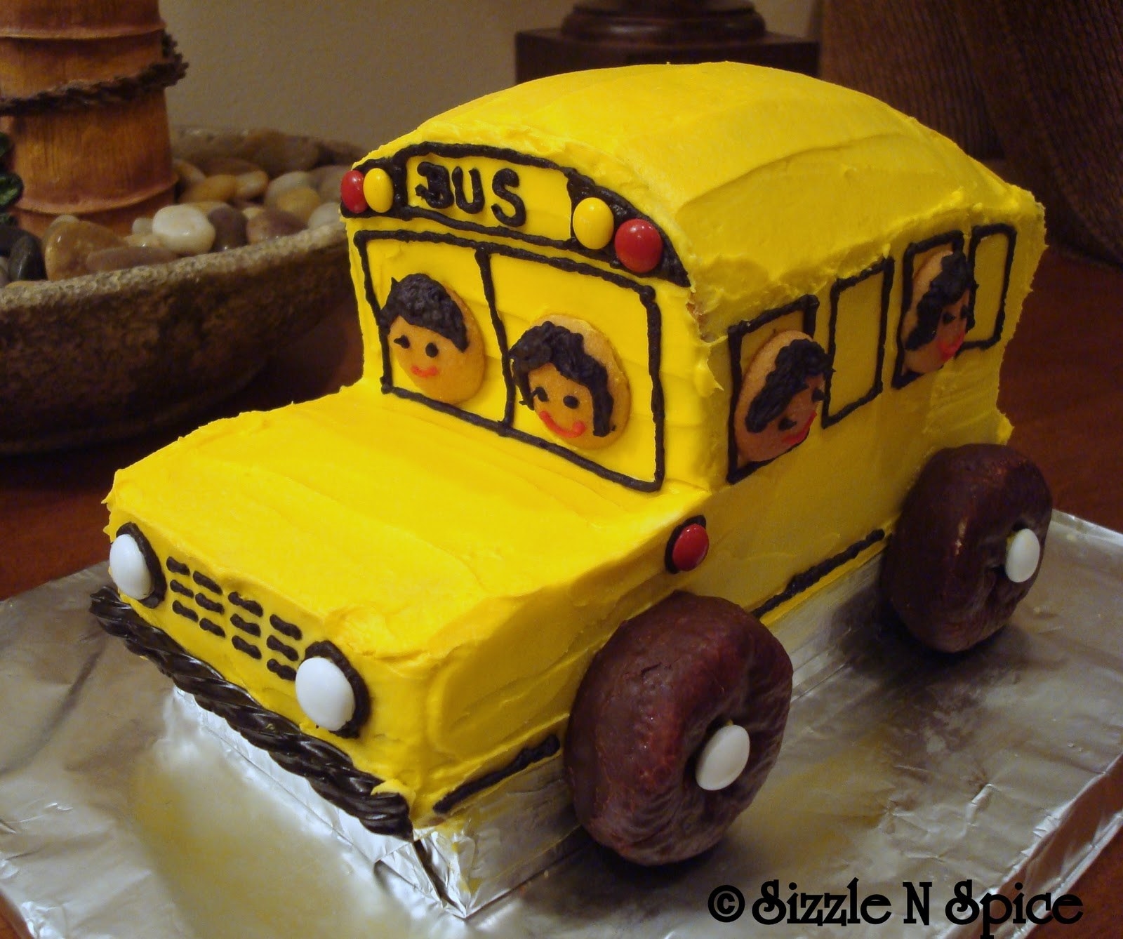 My little angel turned two a couple of months back. We threw a small birthday party for her at home. Since she loves the song "The Wheels On The Bus Go Round and Round", I made a bus cake for her. They also celebrated her birthday at her Daycare. Keeping the same theme in mind, I made some bus themed cupcakes and little bus cookies for her friends at the daycare.