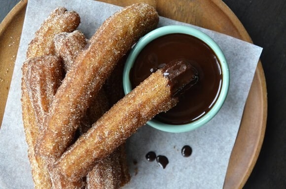 Dig into some churros, the doughnut’s brother from another mother. It’s lighter & you’re always likely to have room for some after a meal.