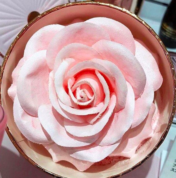 This shimmery and delicate faux rose has powder-infused petals.
