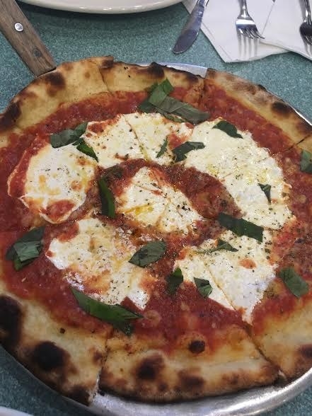 OK, OK I know every other pizza on this list is a traditional NY style slice but let's not discriminate here. Sometimes you just need to order a whole pie to test your determination and perseverance. You either beat the pizza or you let the pizza beat you. BTW, these crispy, light semi-charred pies are addicting. I owned this pizza.