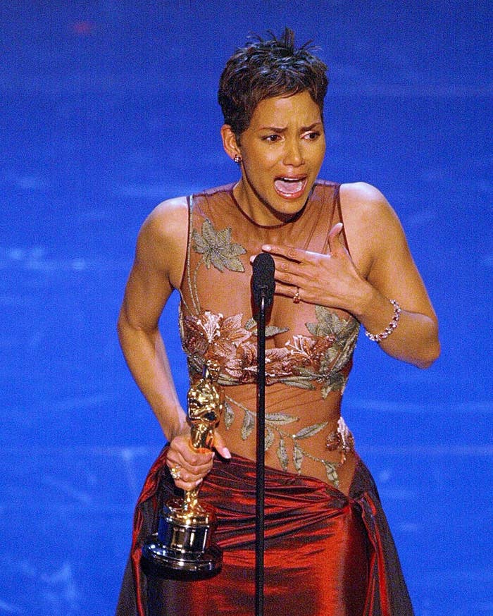 Halle Berry crying while holding her Oscar onstage