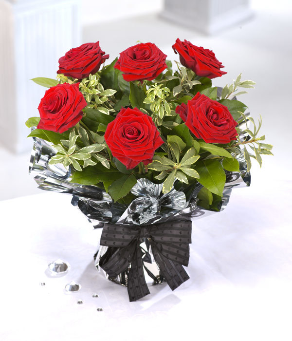 A bunch of flowers or a single rose won’t break the bank and doesn’t have to be a cliché present, not if you buy their favourite type of flowers.