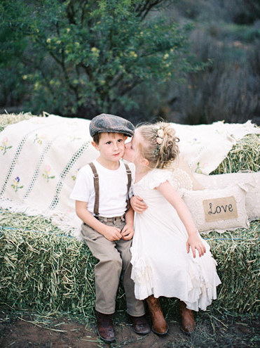 Ringbearers and flower girls are sometimes the highlight of a wedding ceremony. They can be total show stealers. To eliminate any cringe worthy moments from these cool kids, I recommend 6 years old as an ideal age for your mini hype team.The average six year old has already completed a year of elementary school. They are used to listening and taking direction, and this will be a blessing in what can be a chaotic day. Younger than six and you risk tantrums, "accidents," and many other unexpected surprises. Granted some of these surprises lead to adorably awesome memories, so be sure to expect the unexpected with your mini bridal party team!