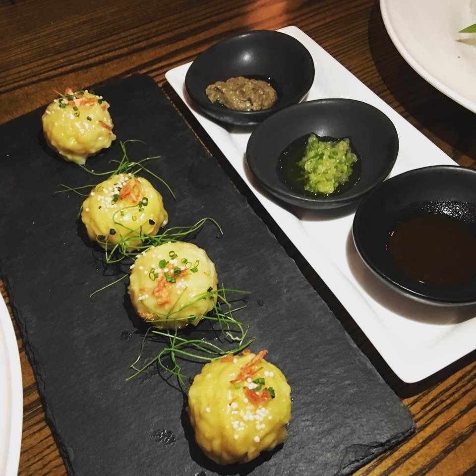 The plump steamed gyoza is stuffed with shrimp, water chestnut, bamboo shoot, pork belly, and egg white. The gyoza is served with three different types of dipping sauces, including truffle oil.