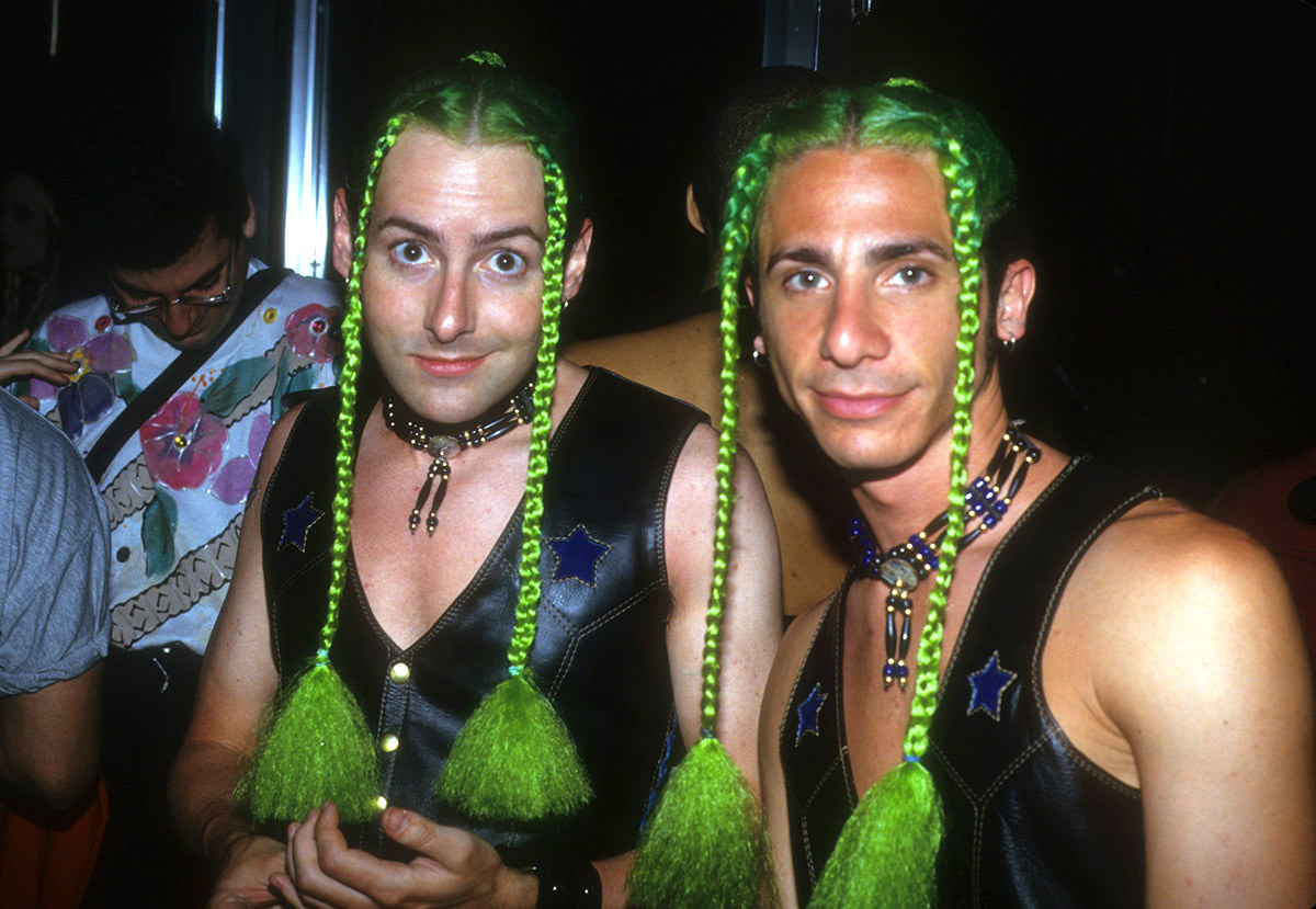 Two clubgoers show off their colorful costumes at Club USA, 1993. 