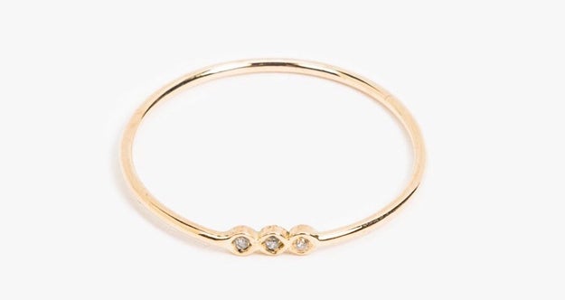 A delicate yellow-gold ring that has just enough sparkle.