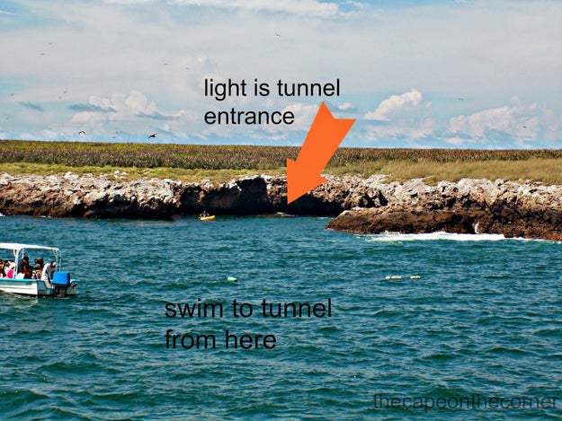 To reach the beach, visitors must swim through a short underwater tunnel.