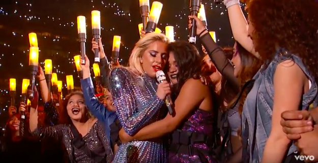 Finally, during her performance of "Million Reasons," Gaga went out onto the field and embraced a fan — while they were surrounded by people holding up torches like the Statue of Liberty.