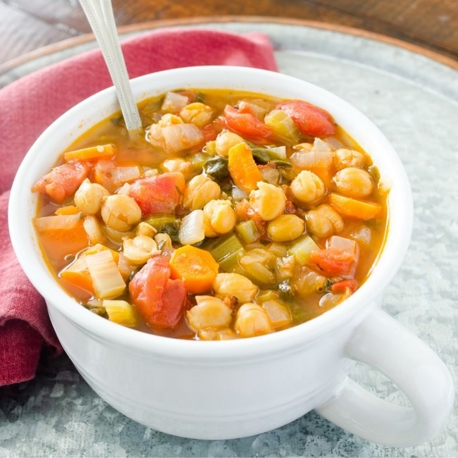 This tomato based garbanzo bean soup is full of vegetables and a twist of fennel seed will keep your taste buds happy the whole bowl through. Dried garbanzo beans over double in size when prepared, so when you buy canned garbanzo beans you are really just paying for water weight. This soup is easy and delicious!