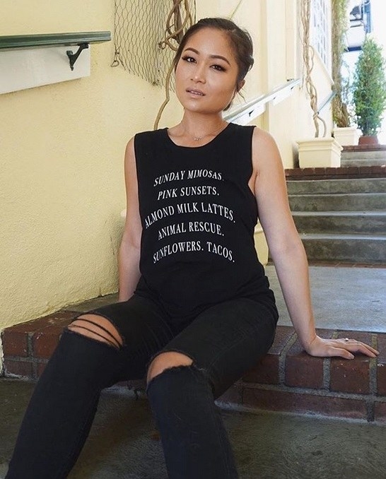 Count me IN for all the things. The Tree Kisser has plenty of vegan inspired apparel and this black muscle tee is a keeper for sure because who doesn't love rescuing animals?