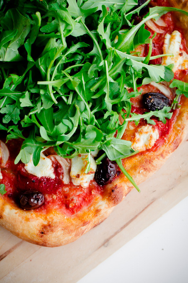 Spicy Red Pepper, Goat Cheese, Olive, and Arugula Pizza