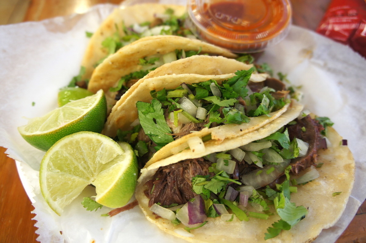 !!!Not Americanized Tacos like from Taco Bell, I repeat not Tacos from Taco Bell!!! Authentic Mexican tacos in a warm soft tortilla filled with beef, pulled pork, or shrimp, guacamole, cilantro, onions, optional spice/jalapenos, and a squeeze of lime. I also don't mind if Queso is added ;) Nothing beats this!