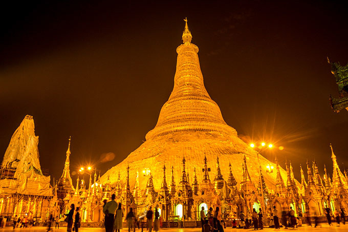 The Shwedagon Pagoda, the holiest place for Burmese Buddhists, stands majestically on a small hill next to Yangon, the country's main city. Walking barefoot through the complex's marble while observing the prayers is a rewarding experience. Let yourself be hypnotized by mantras and chants while the smell of incense burns you. The sunset is the best time to visit when the Pagoda shows its maximum splendor after sunset and its bright golden glow is visible from a distance.