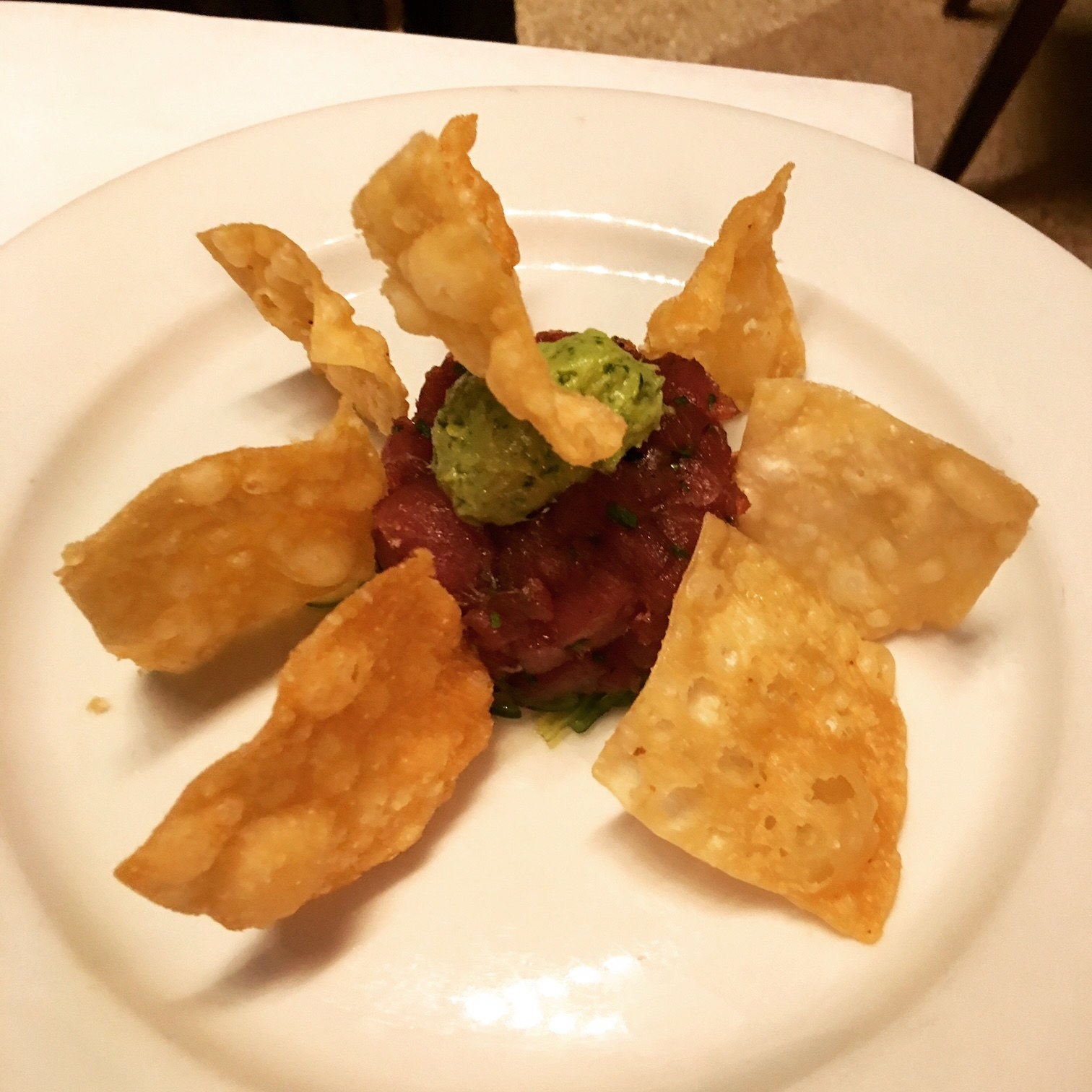 Served over a bed of perfectly seasoned sesame seaweed, the tuna tartare is made with chunks of fresh, raw tuna topped with a dollop of avocado. The crispy wonton chips adds a layer of crunchiness to this appetizer.