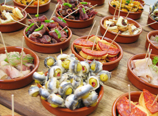 Spaniards know how to balance the chaos of every day life with tasty snacks. Their best invention by far is tapas, which are small plates of food that come with drinks before or after dinner. They're always cheap, and they make for a great social break without the commitment of a full meal! With the hustle and bustle of Los Angeles, tapas are almost a necessity.