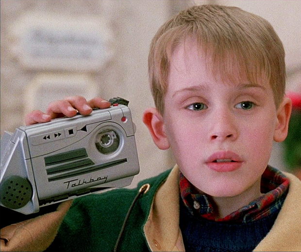 boy holding voice recorder