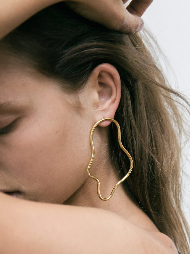 The Elongated Squiggle Earrings by Holly Ryan were designed exclusively in collaboration with The UNDONE. Handcrafted in Australia from 18K Gold Plated Solid Sterling Silver.
