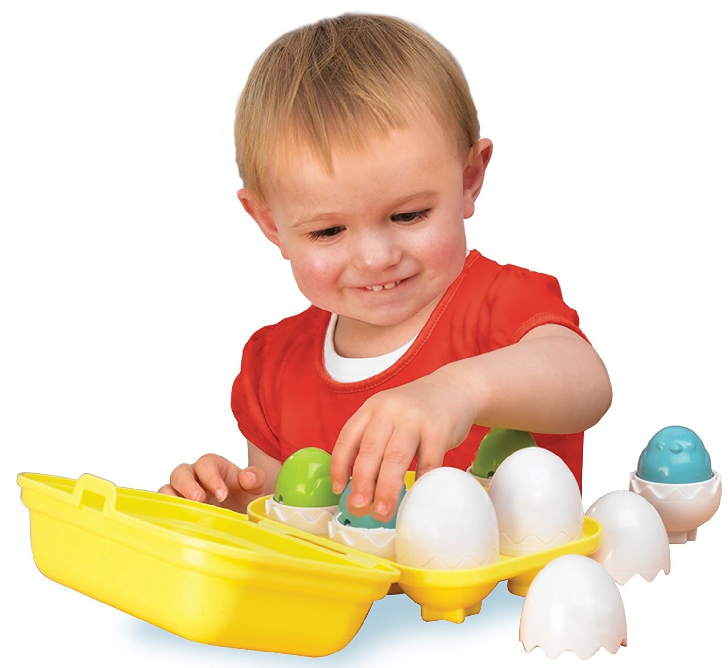 kid playing with a set of egg stacking toys