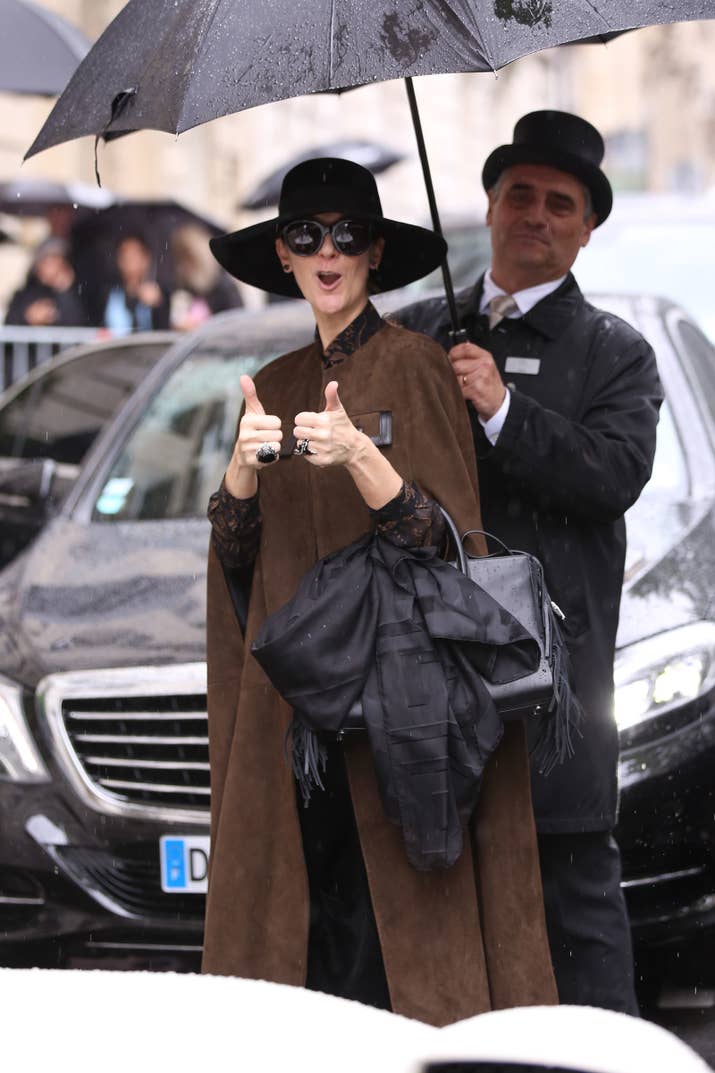 Level of rain: ☔ ☔ ☔ ☔ ☔ ☔ ☔ ☔ Reaction to the rain: Celine does NOT CARE at all! And with someone holding an umbrella behind you, why would you?
