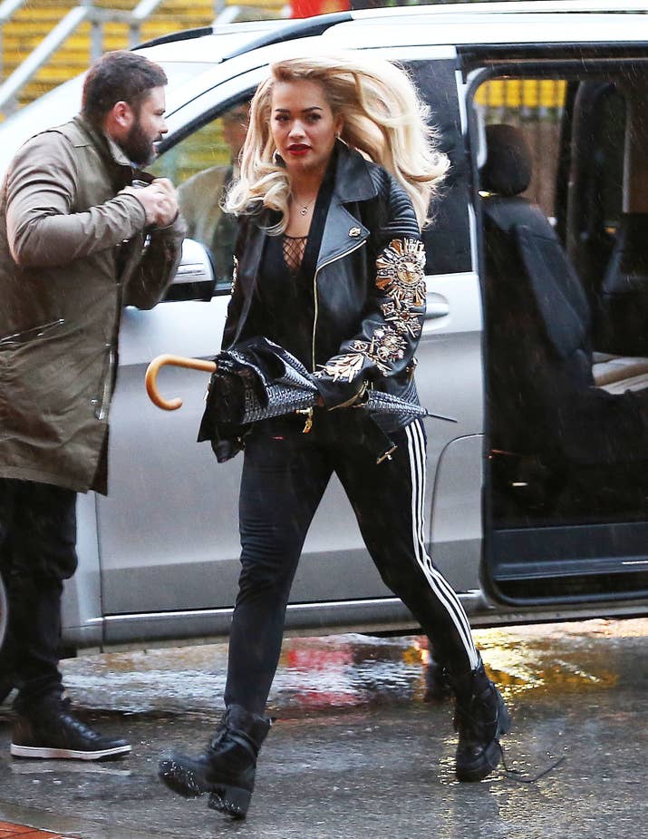 Level of rain: ☔ ☔ ☔ ☔ ☔ ☔ ☔ ☔ Reaction to the rain: Bothered, but not bothered enough to use her umbrella.