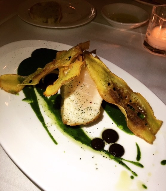 This beautiful cut of swordfish steak, cooked to the temperature of your liking, is served with creamy zucchini puree, dollop of olive oil sauce, and crispy zucchini.