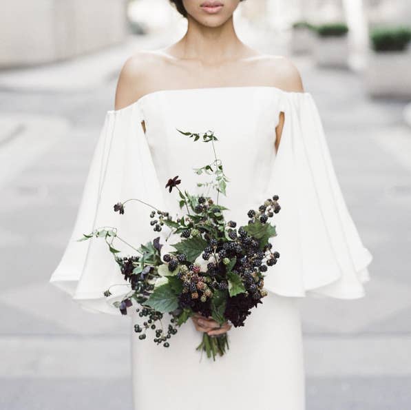 Literally every shirt in stores right now is off-the-shoulder, and the trend has trickled down to wedding dresses, too! Luckily, those dresses can look really stunning, even if you're not Samira Wiley.