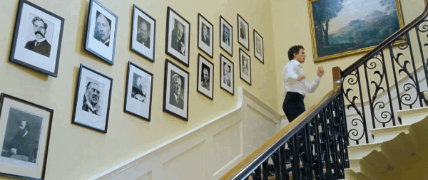 That suggests that he was prime minister after Tony Blair, either defeating him in an election or ousting Tony within his own party.But when you look at the final version, you will see that on the wall Gordon Brown was PM after Tony Blair, who was PM four years after the film was out.