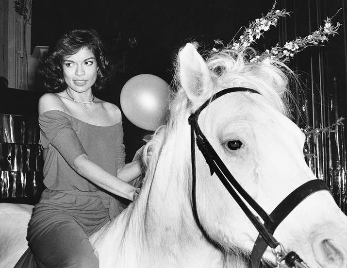 Bianca Jagger rides into Studio 54 on a white horse during her birthday celebrations in 1977.