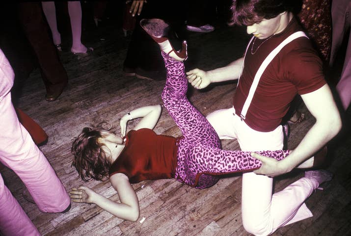 A couple bring their dancing to the floor of the disco club FunHouse in New York City, 1978.