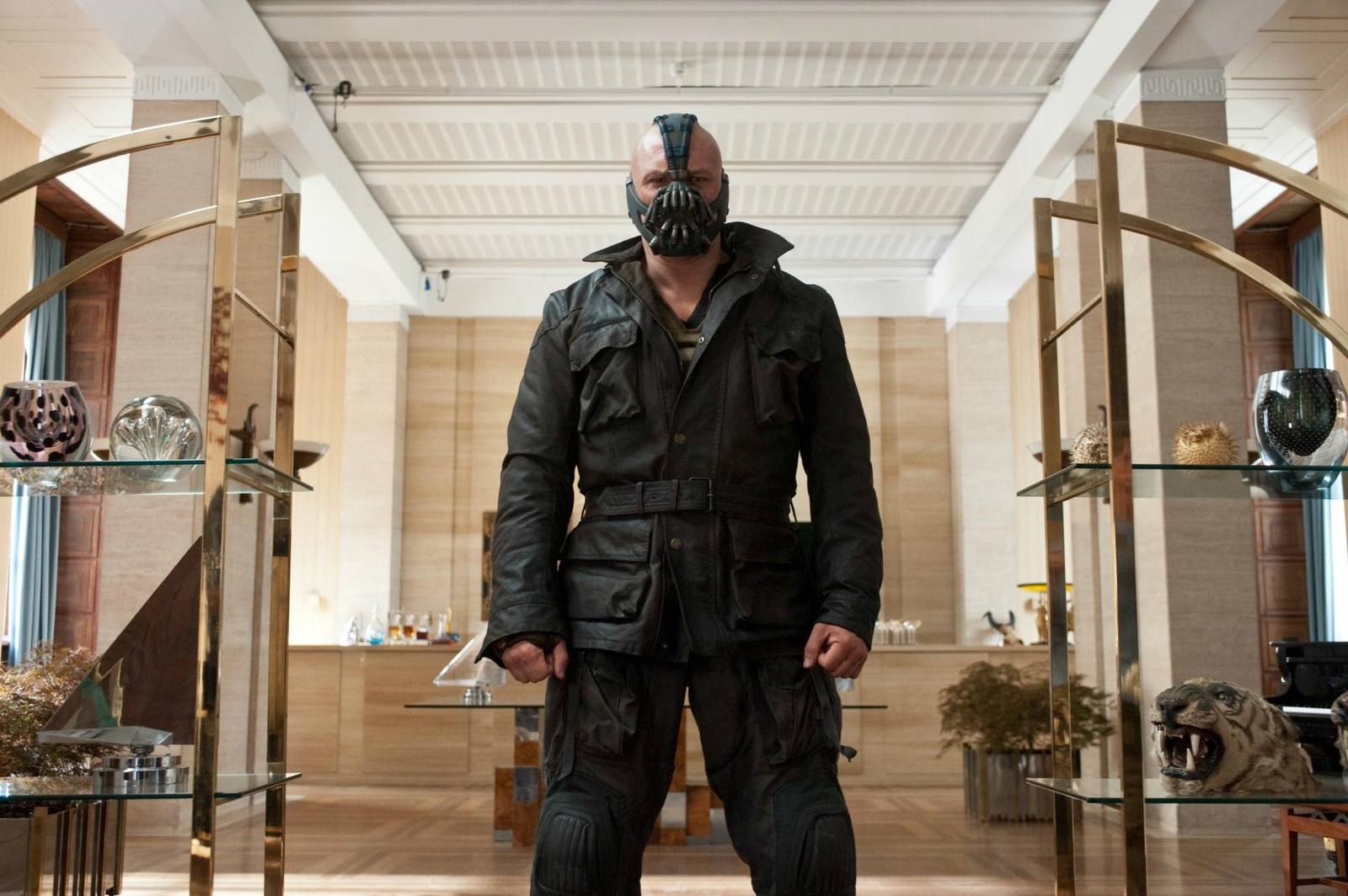 I'm about to geek out heavy on this one so prepare yourselves. Bane is perhaps one of the greatest Batman villains we've ever seen. After that sentence there may be a fair few of you thinking I've forgotten about The Joker but hear me out. The Joker was great BUT there's no backstory in the movies. If this was about comic book villains then the Joker would've made the cut, there's no doubt about it but in The Dark Knight he's crazy just because. In the Dark Knight Rises Bane has a back story and it's one that almost gets you right in the feels. **Spoiler Alert** Through-out the movie, Bane is presumed as the son of Ra's Al Ghul however it turns out to be Miranda Tate, board member of Wayne Enterprises and otherwise known as Talia Al Ghul. The story is that Bane, Tahlia and her mother were sent to the 'pits of hell' where Tahlia's mother was raped and murdered by fellow inmates. Bane helped Tahlia 'escape the same fate as her mother' and for this was brutally attacked leaving him in constant agony and this is how Bane came to wear the mask. It provides him with a constant supply of pain relief and this is why we can't help but love him. Despite being the villain here, he continues to sacrifice literal life and limb for Tahlia. There is of course perhaps the teeniest tiniest influence of the fact that we all know it's Tom Hardy under that mask too.. *Drool.