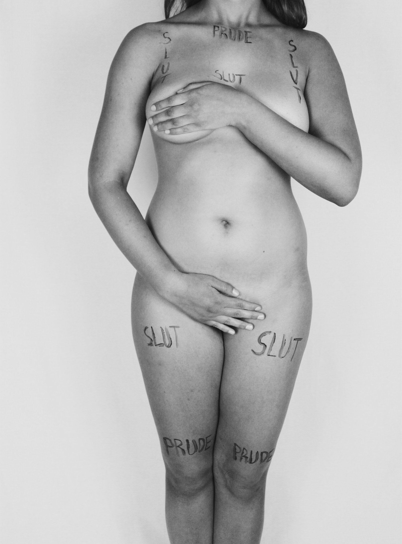 This photo depicts an unjustifiable perspective that many have of women regarding their clothing. Many individuals tend to label women in different derogatory ways because of their clothing choices. No matter what they have on they’ll be criticized or degraded. Concerning sexual assault victims, rapist sympathizers often ask “What was she wearing?”. This is just one statement amongst a host of evidence that proves rape culture exists in this nation and around the world. This idea is that the victim is to blame and not the rapist.