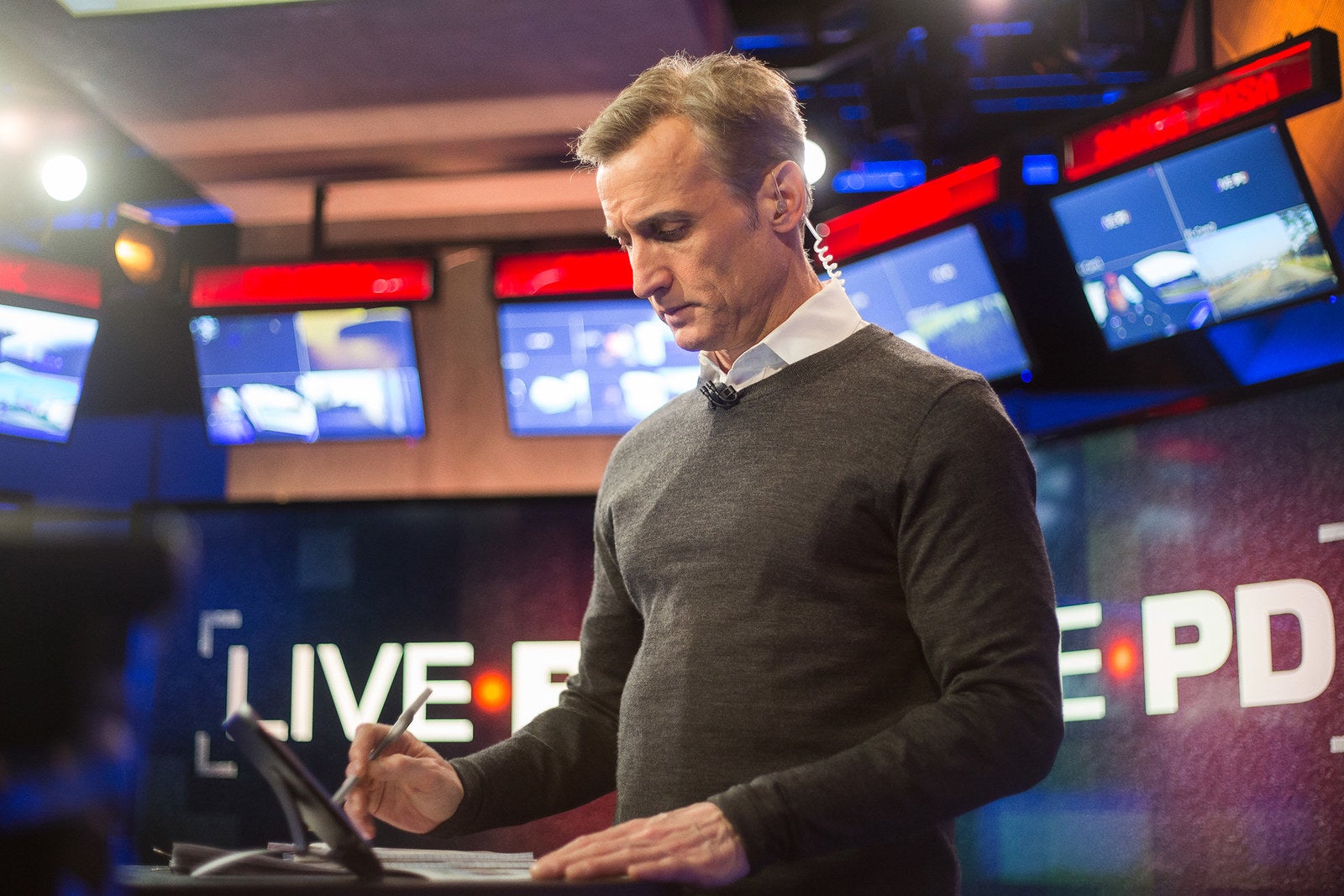 Host Dan Abrams prepares before going live.
