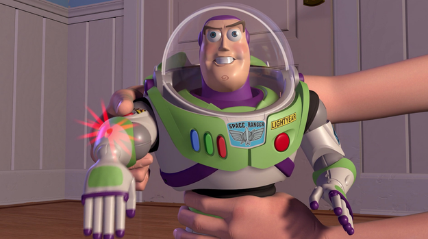 Buzz *THINKS* he's a Space Ranger in Toy Story, but freezes up like the rest of the toys whenever a human is in their presence. What gives?