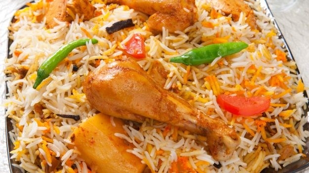 The biryani is a dish of rice from Pakistani cuisine and Indian cuisine made with a mixture of spices as well as basmati rice, meat/vegetables, and yogurt. There are many varieties of biryani and each type has its unique characteristics. From Kashmir to Kanyakumari, from east to west of India, there are different varieties of this dish, which are usually rooted in the ingredients and uses of local cooks. It can be considered in all the cases like a plate elaborated with pan, with the ingredients cooked together in the last stage of preparation. There are mixtures of pre-made spices in India that are sold commercially in supermarkets or shops, trying to reduce cooking times, but the taste differs considerably from traditional processing.The biryani has an uncertain origin, some authors indicate its possible Persian origin because the denomination of the plate comes from the Persian beryān that mean "fried before cooking", it is possible that it made a tour by Afghanistan until arriving at the North of India Perhaps passing through the valley of Thar. Other authors mention that it may have a connection with the Turkish Pilav. The dish considered suitable for the high classes, during the Mughal Empire was disseminated and could be available for the most humble classes. At present, it is a dish very linked to the Muslim populations in India .The spices and condiments used in the elaboration of the biryani are those that contribute to elemental form to the flavor of this plate; they correspond to nails, cardamom, cinnamon, bay leaves, coriander and mint leaves, besides usually they take in the preparation oil ghi, ginger, onions, garlic, and yogurt. The most exquisite variants usually include saffron and in some cases, the use of Garam Masala (spice mixture) is mentioned.For non-vegetarians there are biryanis whose main ingredient that accompanies spices is meat - chicken, turkey, lamb (is the most traditional) or sometimes veal. Otherwise, you can find a very popular variety of biryani made with only vegetables (called Tahari). In Bangladesh, the Tahari concept refers to the Biryani prepared by adding the meat to the rice, as opposed to the traditional Biryani where rice is added to the meat. The difference between the biryani and the pulao is that in the pulao the ingredients are cooked together, in the biryani it is customary to cook the rice separate from the other foods. The dish is usually served with raita, korma, curry or brinjal (eggplant).There are different methods of preparing a biryani, the Hyderabad Biryani is one of the most popular versions of biryani. Nizam cuisine usually has about 49 types of biryani, which includes fish, partridge, prawn, venison and hare. The Sindhi variant of biryani is very popular in Pakistani cuisine and there are several varieties of biryani in almost the entire territory. Another popular biryani dish is the Awadhi biryani.