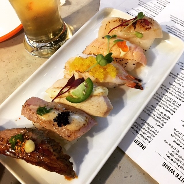 Yo! Sushi features 6 varieties of aburi sushi, or sushi that has been flame-seared for richer flavor. Choose from (top to bottom) scallop, salmon, shrimp, hamachi, tuna, or beef.