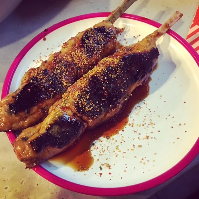 Mince chicken, shiro miso, and shiso leaf grilled in skewers with teriyaki glaze and shichimi