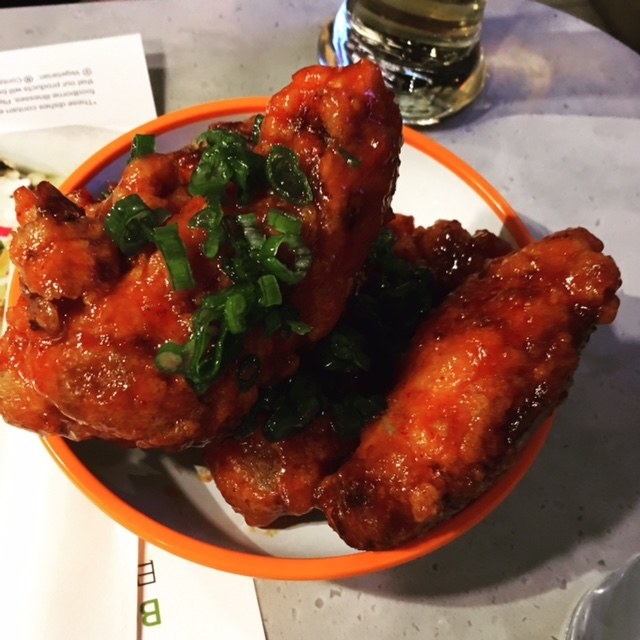 Crispy fried marinated chicken wings in three different sauces. Choose from Japanese (dusted with sansho pepper and lemon), Korean (coated in spicy Korean gochujang sauce), or Asian (coated in sticky teriyaki, sesame oil, and white sesame)
