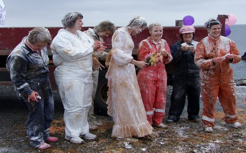 Blackening in Scottish wedding tradition is becoming increasingly popular among the couples where both are taken out on the day before their wedding and put anything from liquid, flour, treacle to custard to make them dirty as possible before they are coated in feathers.