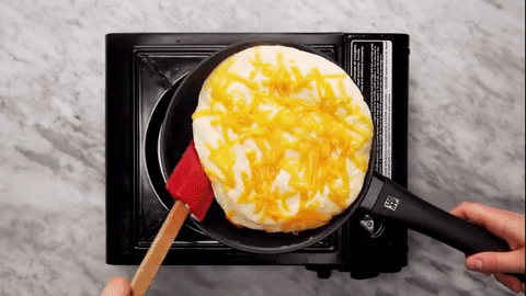 Whipping your egg whites until light and ribbony results in a light-as-air omelette like you've never had before. See the full video here.