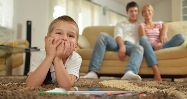 This photo demonstrates permissive parenting. Permissive parenting is high in warmth and low in control. In this photo, the child seems to be happy. The parents are also happy and not controling what he is doing. The parents seem like they are just relaxing while allowing the child to do what he enjoys doing.
