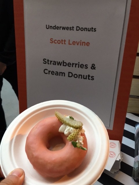 Dense cake donut glazed with strawberry frosting and topped with fresh strawberries and cream by Chef Scott Levine of Underwest Donuts