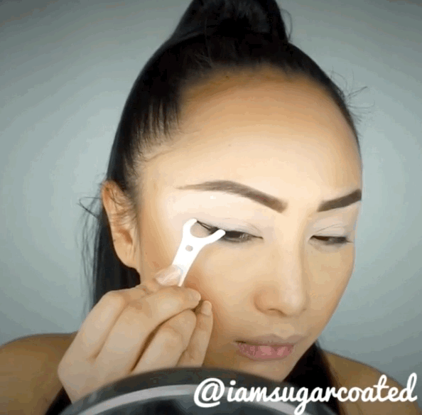 If you're terrible at doing your own eyeliner, use a throwaway flosser to get a perfect wing.