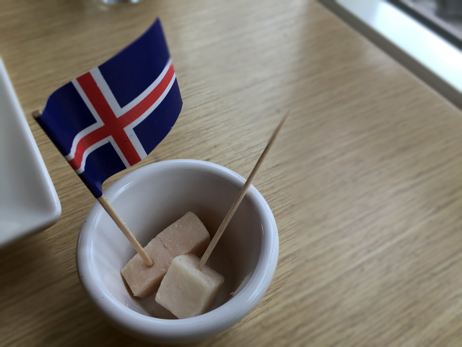 It looks so innocent, like samples of turkey in the grocery store. Don't be fooled. This little cube is packing the punch of strong fermented shark.