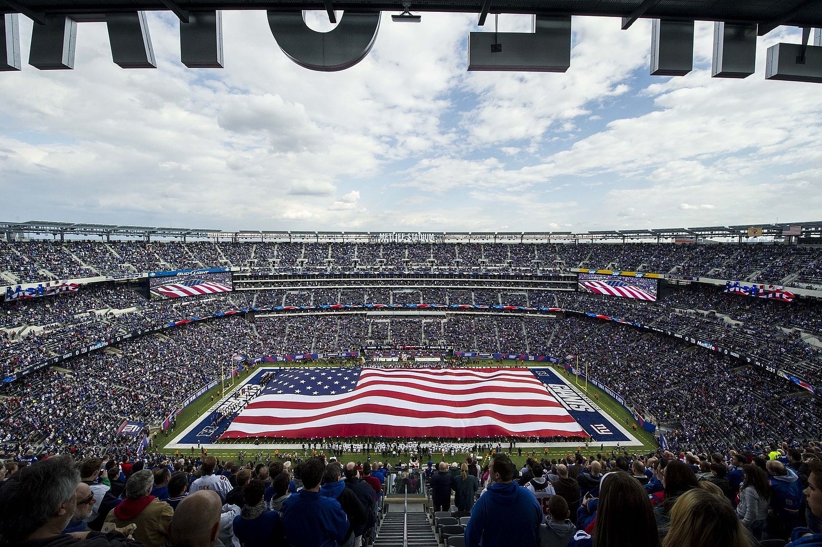 New York, New York. We love to beat the Giants. Find a reasonably priced accommodation and then spend your time seeing the sites.