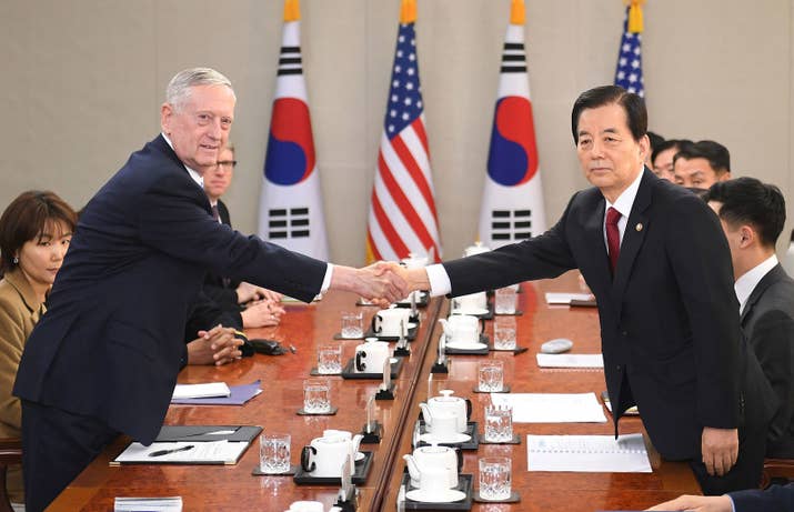 US Defense Secretary James Mattis (L) shakes hands with South Korean Defense Minister Han Min-Koo in Seoul in February