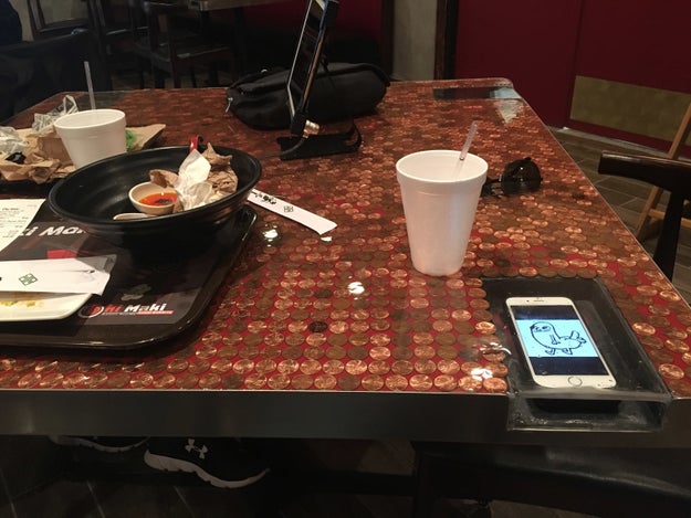 The restaurant tables that have a safe place for your phone to avoid spilling anything on it.